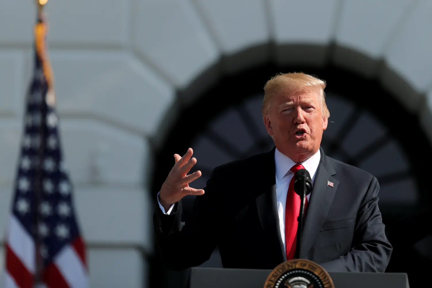 U.S. President Donald Trump speaks about the economy while delivering remarks on the South Lawn of the White House in Washington, U.S., July 27, 2018. REUTERS/Carlos Barria - RC1866349EE0