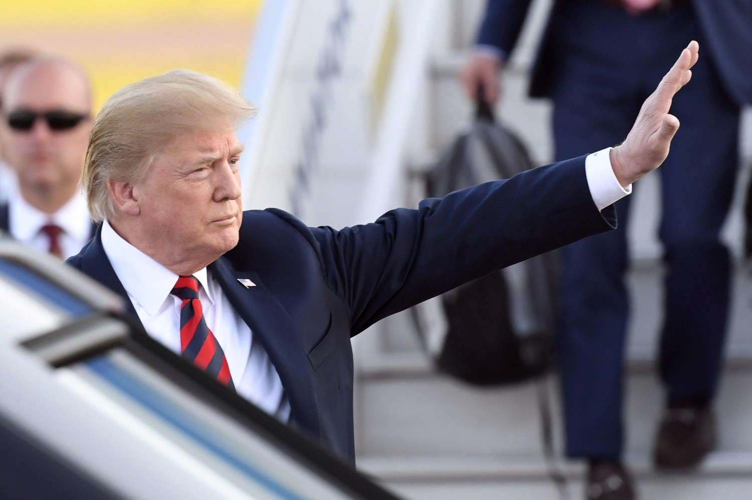 U.S. President Donald Trump waves to the media after arriving in Vantaa, Finland, July 15, 2018. Lehtikuva/Heikki Saukkomaa via REUTERS ATTENTION EDITORS - THIS IMAGE WAS PROVIDED BY A THIRD PARTY. NO THIRD PARTY SALES. NOT FOR USE BY REUTERS THIRD PARTY DISTRIBUTORS. FINLAND OUT. - RC146B60FF50