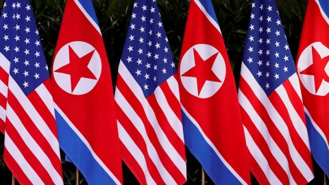 U.S. and North Korean national flags are seen during the meeting of U.S. President Donald Trump and North Korean leader Kim Jong Un at the Capella Hotel on Sentosa island in Singapore June 12, 2018. REUTERS/Jonathan Ernst - RC1C1F358640