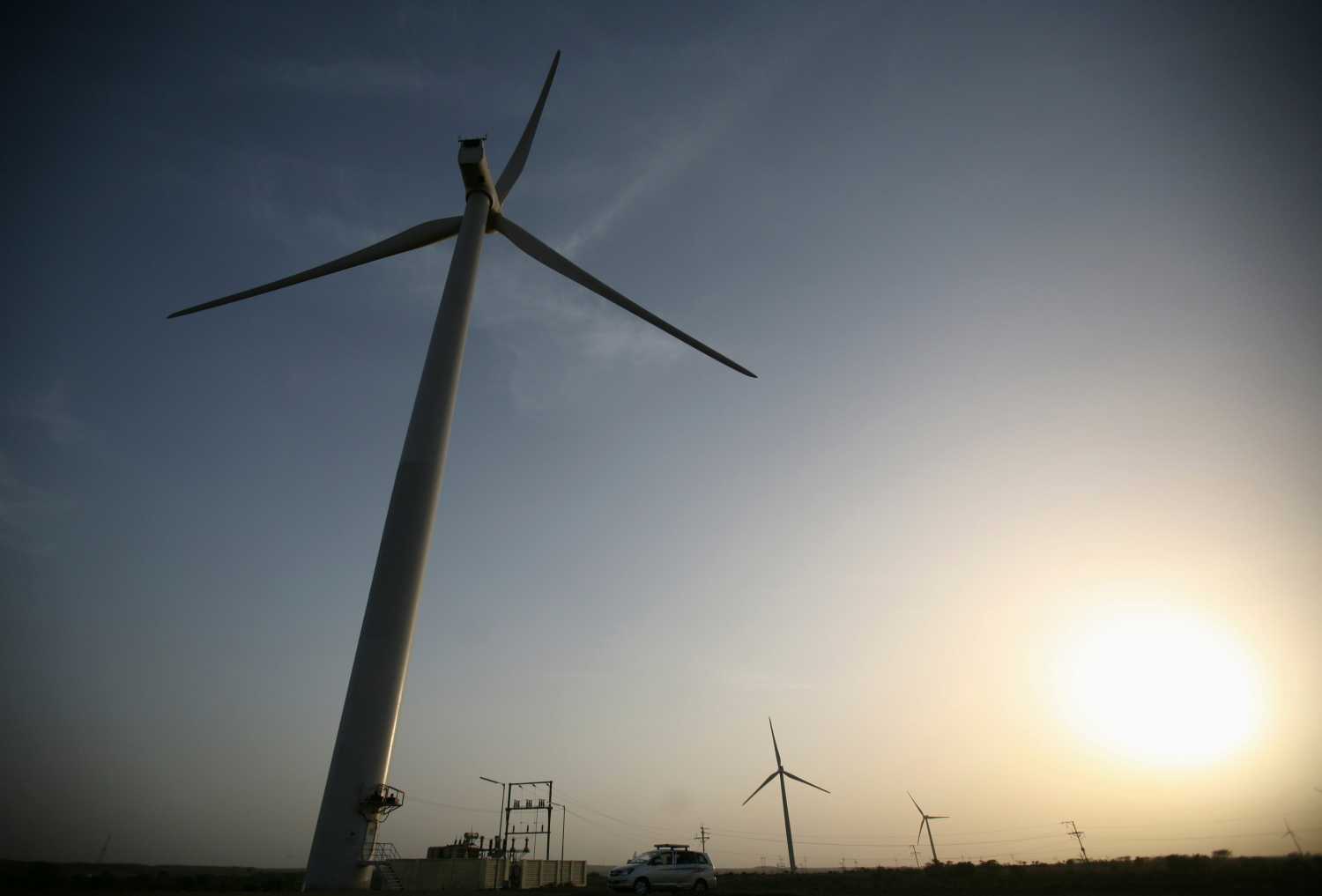 Power generating windmill turbines are pictured during the inauguration ceremony of the new 25 MW ReNew Power wind farm at Kalasar village in the western Indian state of Gujarat May 6, 2012. REUTERS/Amit Dave (INDIA - Tags: ENERGY BUSINESS) - GM1E85700TW02
