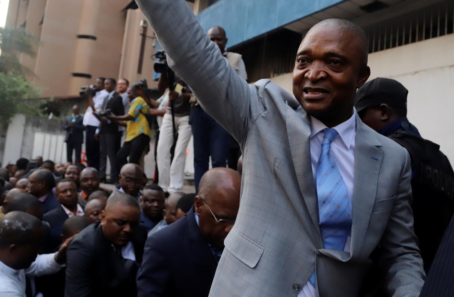 Former Congolese interior minister Emmanuel Ramazani Shadary waves to his supporters as he arrives to file his candidacy for the presidential election, at the Congo's electoral commission (CENI) head offices at the Gombe Municipality in Kinshasa, Democratic Republic of Congo, August 8, 2018. REUTERS/Kenny Katombe - RC1CD82EFFD0