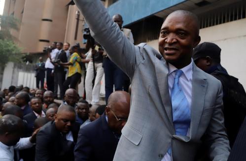 Former Congolese interior minister Emmanuel Ramazani Shadary waves to his supporters as he arrives to file his candidacy for the presidential election, at the Congo's electoral commission (CENI) head offices at the Gombe Municipality in Kinshasa, Democratic Republic of Congo, August 8, 2018. REUTERS/Kenny Katombe - RC1CD82EFFD0