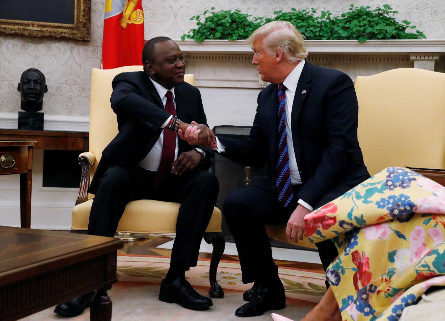 Kenya's President Uhuru Kenyatta shakes hands with U.S. President Donald Trump as they meet in the Oval Office at the White House in Washington, U.S., August 27, 2018. REUTERS/Leah Millis - RC1D0C9E7900
