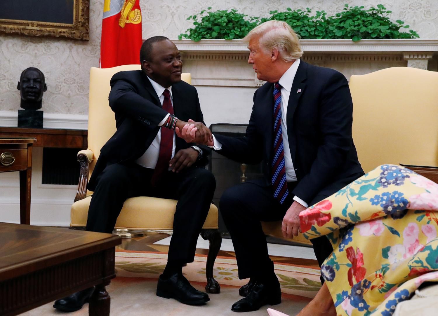Kenya's President Uhuru Kenyatta shakes hands with U.S. President Donald Trump as they meet in the Oval Office at the White House in Washington, U.S., August 27, 2018. REUTERS/Leah Millis - RC1D0C9E7900