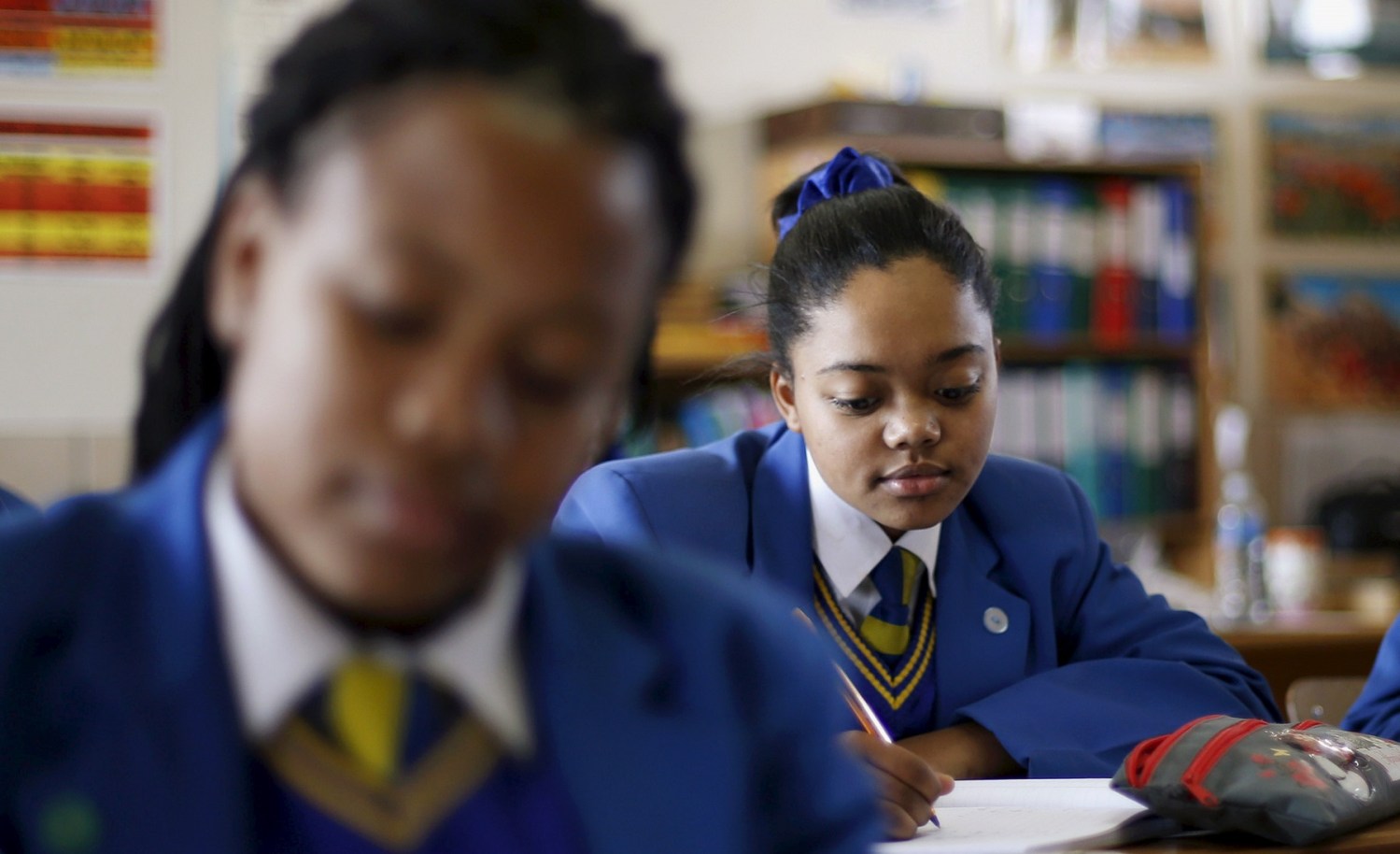 School children attend class at Waterstone College, a private school managed by Curro in the south of Johannesburg July 22, 2015. South African private education group Advtech rejected a takeover offer from its bigger rival Curro Holdings, saying on Tuesday the proposal contained "unacceptable pre-conditions". Advtech's shares fell more than 7 percent shortly after the announcement that it had rejected Curro's bid, but pared losses to close down 2.93 percent at 11.60 rand. The shares are up about 30 percent so far this year. Curro's stock shed 0.83 percent to close on 11.70 rand. REUTERS/Siphiwe Sibeko  - GF10000166735