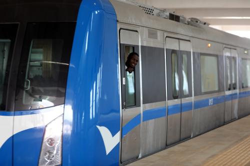 A passenger smiles as he looks out of the newly commissioned Abuja light rail train at the station In Abuja, Nigeria July 17, 2018. Picture taken July 17, 2018.  REUTERS/Afolabi Sotunde - RC11A602DF80