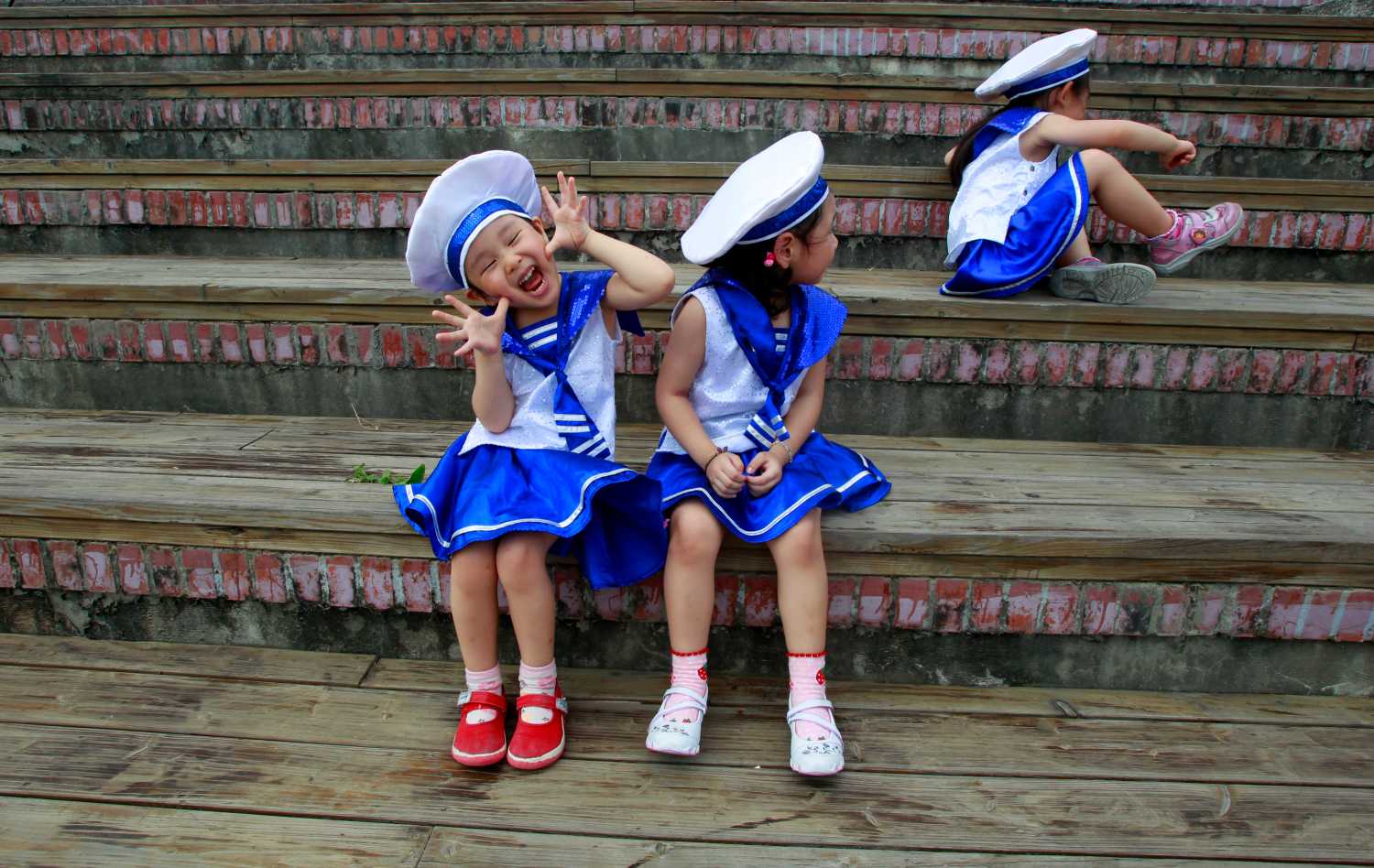 Children dressed in sailor outfits play before a performance during World Oceans Day celebrations in Taipei June 8, 2011. REUTERS/Nicky Loh (TAIWAN - Tags: SOCIETY) - GM1E7681AQU01