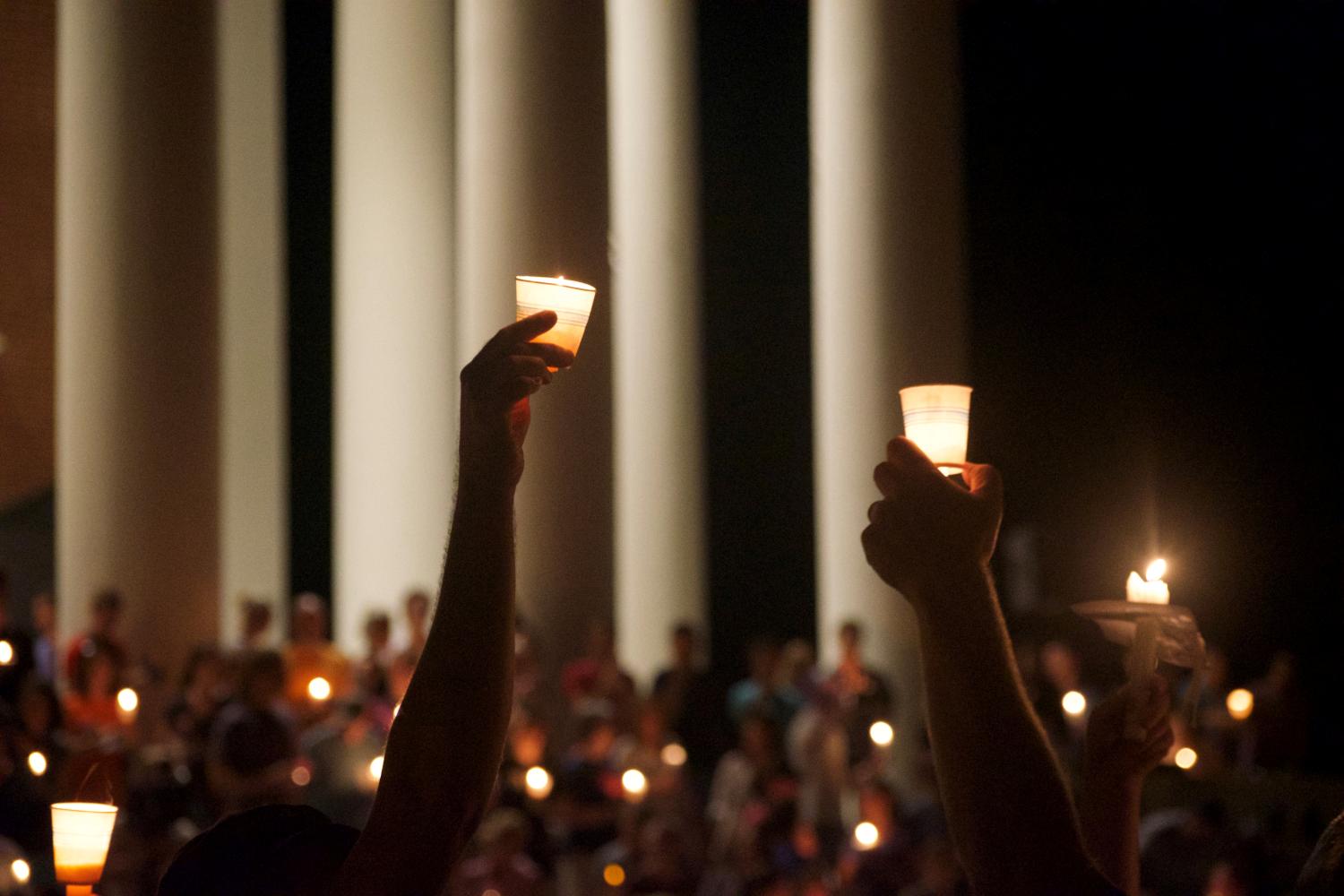 Members of the Charlottesville community hold a vigil for Heather Heyer at the University of Virginia in Charlottesville.