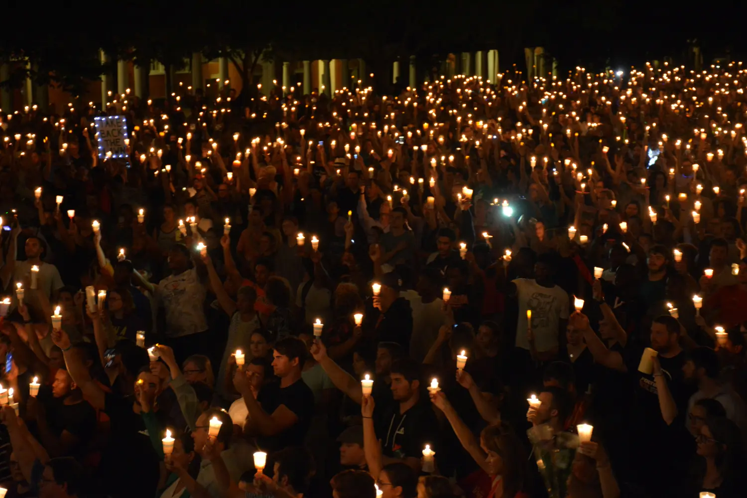Members of the Charlottesville community hold a vigil for Heather Heyer following last Saturday's protest organized by white nationalists that turned deadly at the University of Virginia in Charlottesville, Virginia, U.S. on August 16, 2017. Picture taken on August 16, 2017.   Courtesy Tim Dodson/The Cavalier Daily/Handout via REUTERS   ATTENTION EDITORS - THIS IMAGE WAS PROVIDED BY A THIRD PARTY. MANDATORY CREDIT. - RC1AE091ECB0