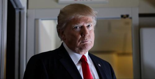 U.S. President Donald Trump pauses as he talks to journalists who are members of the White house travel pool on board Air Force One during his flight to Palm Beach, Florida while over South Carolina, U.S., February 3, 2017. REUTERS/Carlos Barria     TPX IMAGES OF THE DAY - RC1E3D1572C0