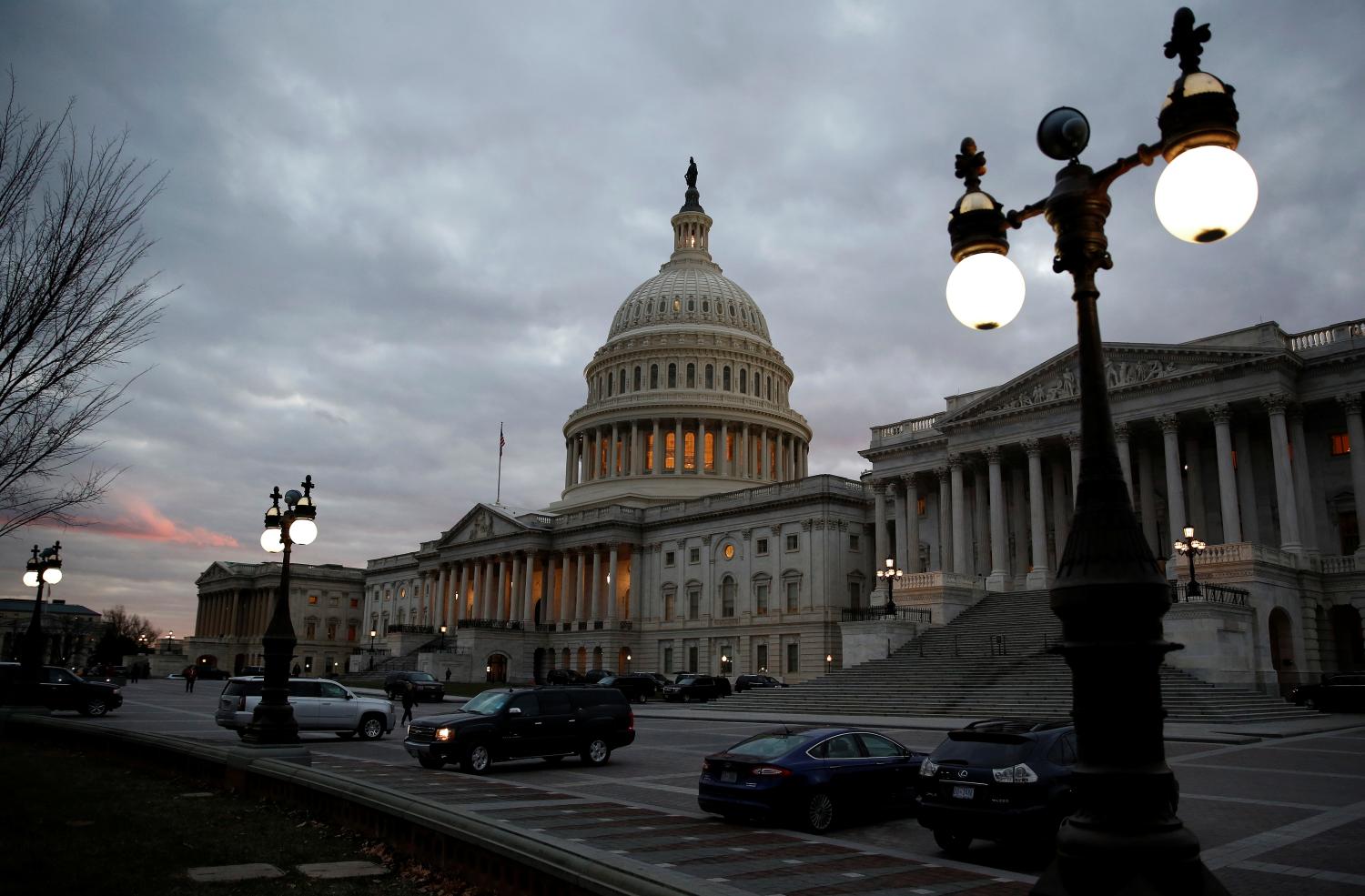 The U.S. Capitol building lit at dusk .