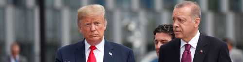 U.S. President Donald Trump and Turkish President Tayyip Erdogan attend the start of the NATO summit in Brussels, Belgium July 11, 2018.  REUTERS/Kevin Lamarque - RC117DD2EDF0