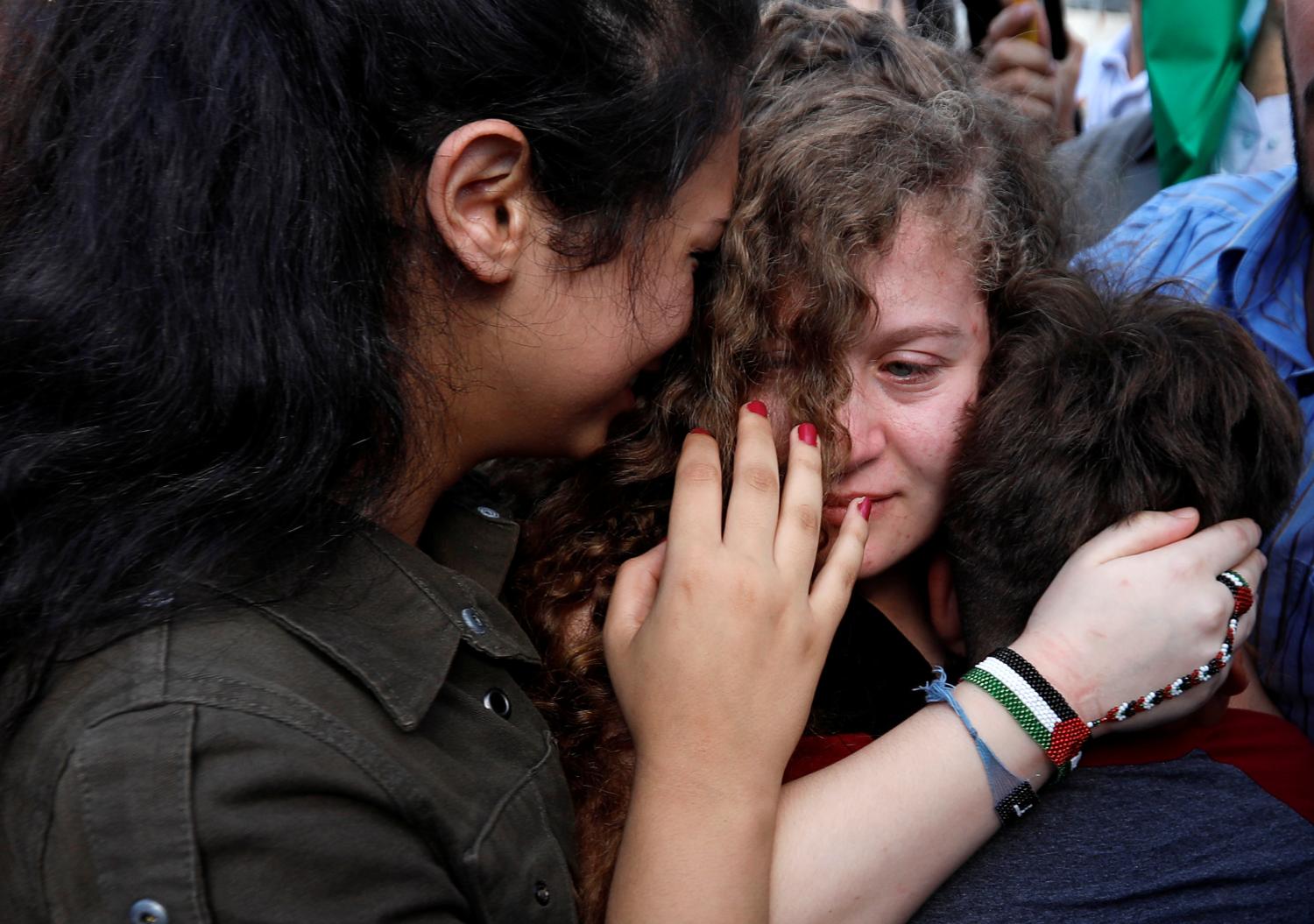 Palestinian teenager Ahed Tamimi is welcomed by relatives and supporters after she was released from an Israeli prison, at Nabi Saleh village in the occupied West Bank July 29, 2018. REUTERS/Mohamad Torokman