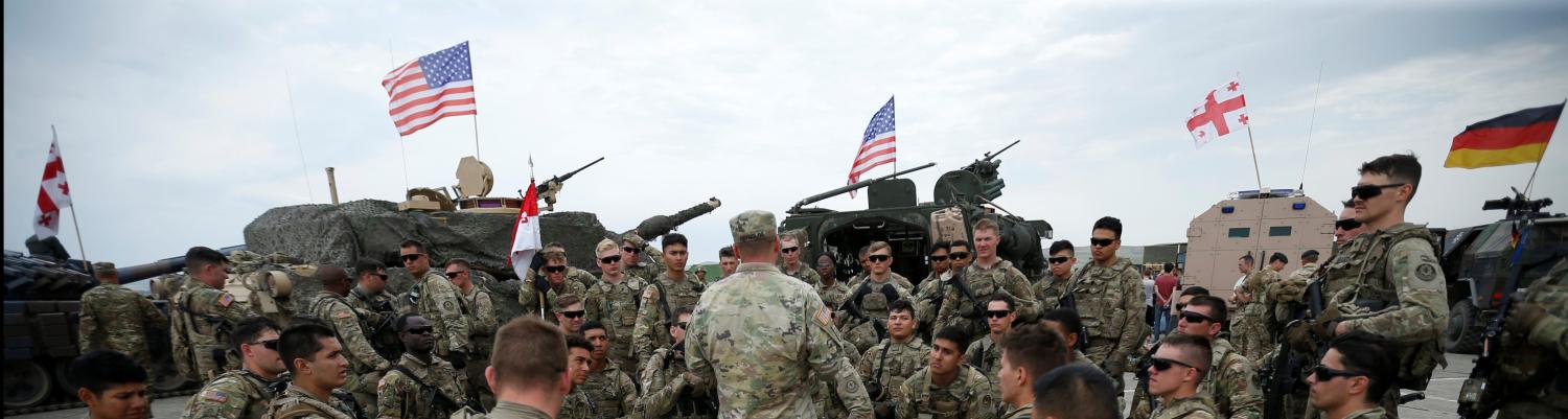 U.S. servicemen rest after an opening ceremony of the NATO-led military exercises "Noble Partner 2018" at Vaziani military base outside Tbilisi, Georgia, August 1, 2018. REUTERS/David Mdzinarishvili - RC1425E4A550