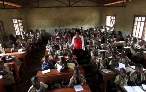 A teacher leads a class session at the ecole primaire Ave Marie in Burundi's capital Bujumbura,  April 24, 2015. Nearly three years after Taliban gunmen shot Pakistani schoolgirl Malala Yousafzai, the teenage activist last week urged world leaders gathered in New York to help millions more children go to school. World Teachers' Day falls on 5 October, a Unesco initiative highlighting the work of educators struggling to teach children amid intimidation in Pakistan, conflict in Syria or poverty in Vietnam. Even so, there have been some improvements: the number of children not attending primary school has plummeted to an estimated 57 million worldwide in 2015, the U.N. says, down from 100 million 15 years ago. Reuters photographers have documented learning around the world, from well-resourced schools to pupils crammed into corridors in the Philippines, on boats in Brazil or in crowded classrooms in Burundi.  REUTERS/Thomas Mukoya  PICTURE 18 OF 47 FOR WIDER IMAGE STORY "SCHOOLS AROUND THE WORLD"SEARCH "EDUCATORS SCHOOLS" FOR ALL IMAGES - GF10000226443