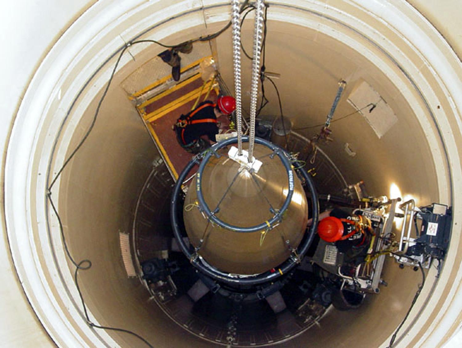 A US Air Force missile maintenance team removes the upper section of an intercontinental ballistic missile with a nuclear warhead in an undated USAF photo at Malmstrom Air Force Base, Montana. Reviews of the U.S. nuclear arsenal show significant changes are needed to ensure the security and effectiveness of the force, a Defense Department report said November 14, 2014.  REUTERS/USAF/Airman John Parie/handout via Reuters (UNITED STATES - Tags: MILITARY POLITICS) FOR EDITORIAL USE ONLY. NOT FOR SALE FOR MARKETING OR ADVERTISING CAMPAIGNS. THIS IMAGE HAS BEEN SUPPLIED BY A THIRD PARTY. IT IS DISTRIBUTED, EXACTLY AS RECEIVED BY REUTERS, AS A SERVICE TO CLIENTS - TM3EABE0Z0U01