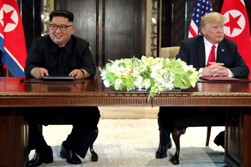 U.S. President Donald Trump and North Korea's leader Kim Jong Un hold a signing ceremony at the conclusion of their summit at the Capella Hotel on the resort island of Sentosa, Singapore June 12, 2018. Picture taken June 12, 2018. REUTERS/Jonathan Ernst