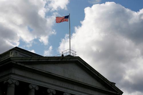 FILE PHOTO: The United States flag flies atop the U.S. Treasury Department in Washington November 18, 2008. REUTERS/Jim Bourg/File Photo GLOBAL BUSINESS WEEK AHEAD - RC1EE0142150