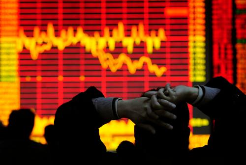 An investor looks at an electronic board showing stock information at a brokerage house in Hefei, Anhui province December 9, 2008. China's stock market dropped in heavy trade on Tuesday, led by property and financial shares, on worries that November economic data, to be released in coming days, would be poor. REUTERS/Stringer (CHINA).  CHINA OUT. NO COMMERCIAL OR EDITORIAL SALES IN CHINA. - GF2E4C90PRF01
