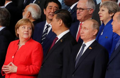 German Chancellor Angela Merkel, Chinese President Xi Jinping, Russian President Vladimir Putin, Turkish President Recep Tayyip Erdogan Japanese Prime Minister Shinzo Abe, Australian Prime Minister Malcolm Turnbull Britain's Prime Minister Theresa May  prepare for a family photo at the G20 leaders summit in Hamburg, Germany July 7, 2017. REUTERS/Wolfgang Rattay - RC115C915250