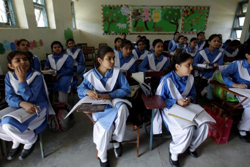 Students listen to their teacher during a lesson at the Islamabad College for girls in Islamabad, Pakistan, October 13, 2017. REUTERS/Caren Firouz  SEARCH "FIROUZ EDUCATION" FOR THIS STORY. SEARCH "WIDER IMAGE" FOR ALL STORIES. - RC15B45AD320