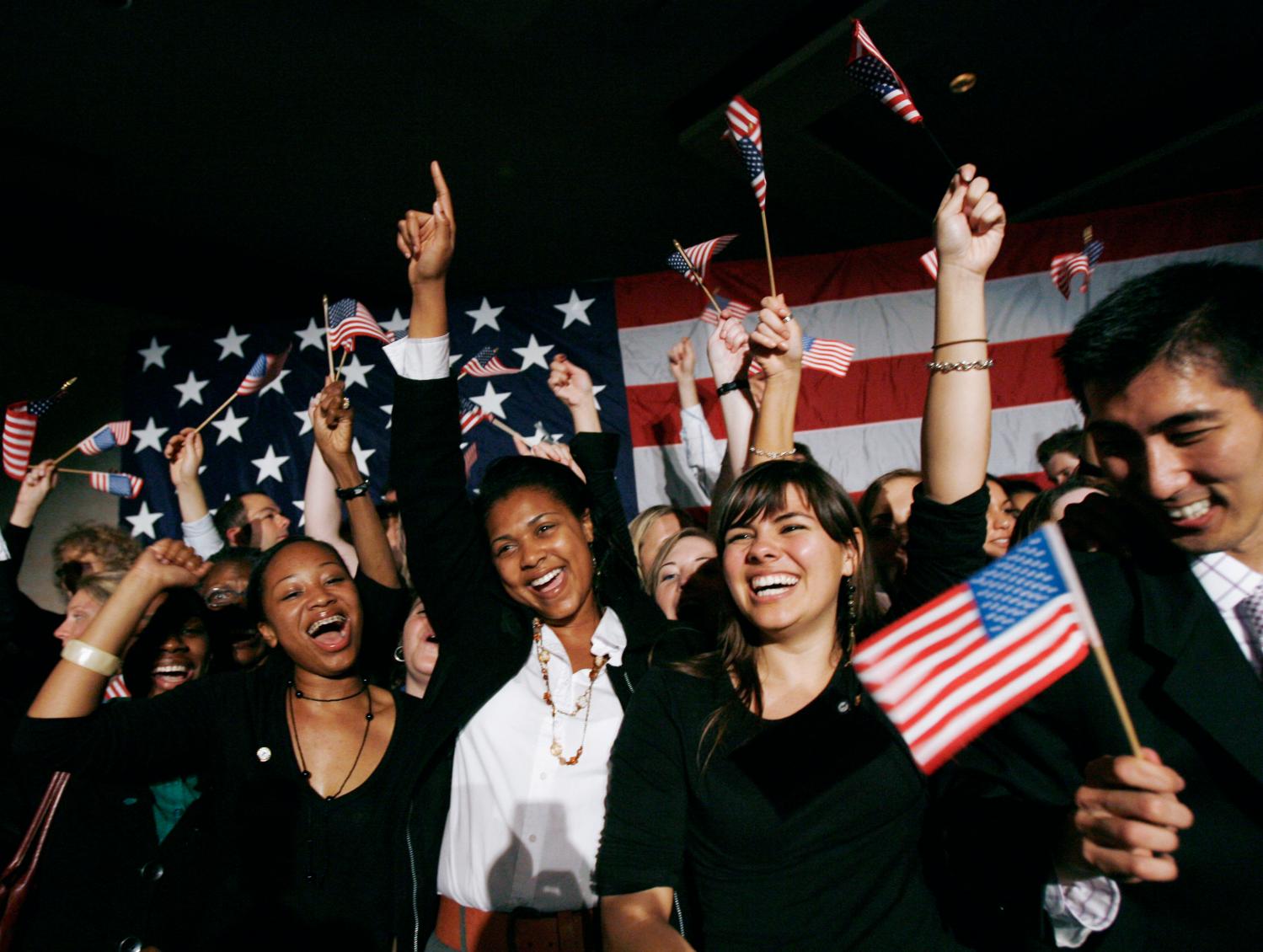 Democratic party supporters react as TV news first predict that the Democratic Party will control the U.S. House of Representatives at a midterm election night party for the Democratic Party in Washington, November 7, 2006. Americans voted on Tuesday in elections for Congress that could curb the power of George W. Bush's Republicans, force a change of direction in Iraq and shape the legacy of a president with two years left in office.   REUTERS/Jason Reed  (UNITED STATES) - GM1DTWXXFFAA