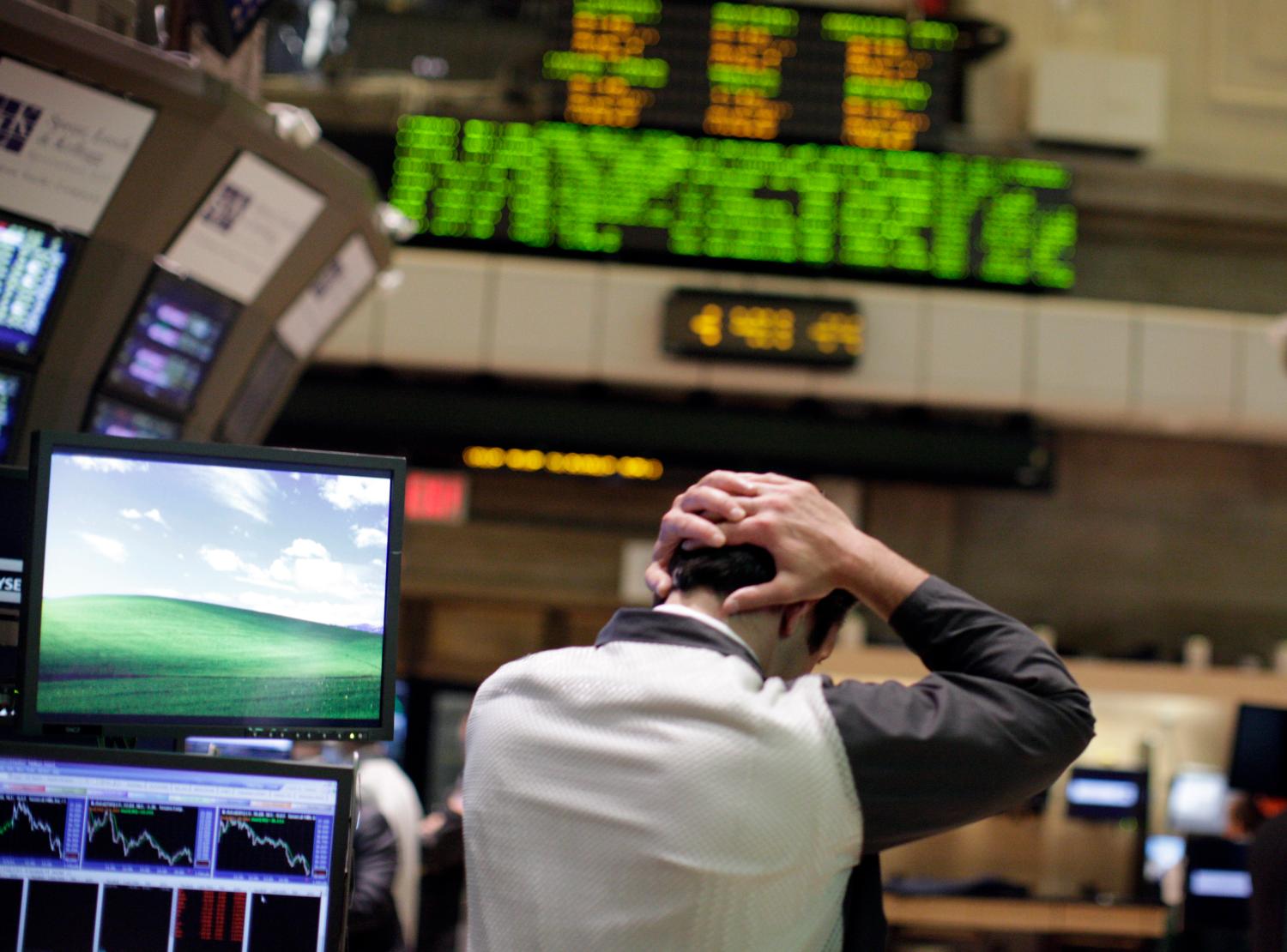 A trader works on the floor of the New York Stock Exchange August 4, 2011. Investors fled Wall Street in the worst stock-market selloff since the depths of the Great Recession in early 2009 in what has turned into a full-fledged correction. REUTERS/Brendan McDermid (UNITED STATES - Tags: BUSINESS IMAGES OF THE DAY) - GM1E7850E2U01