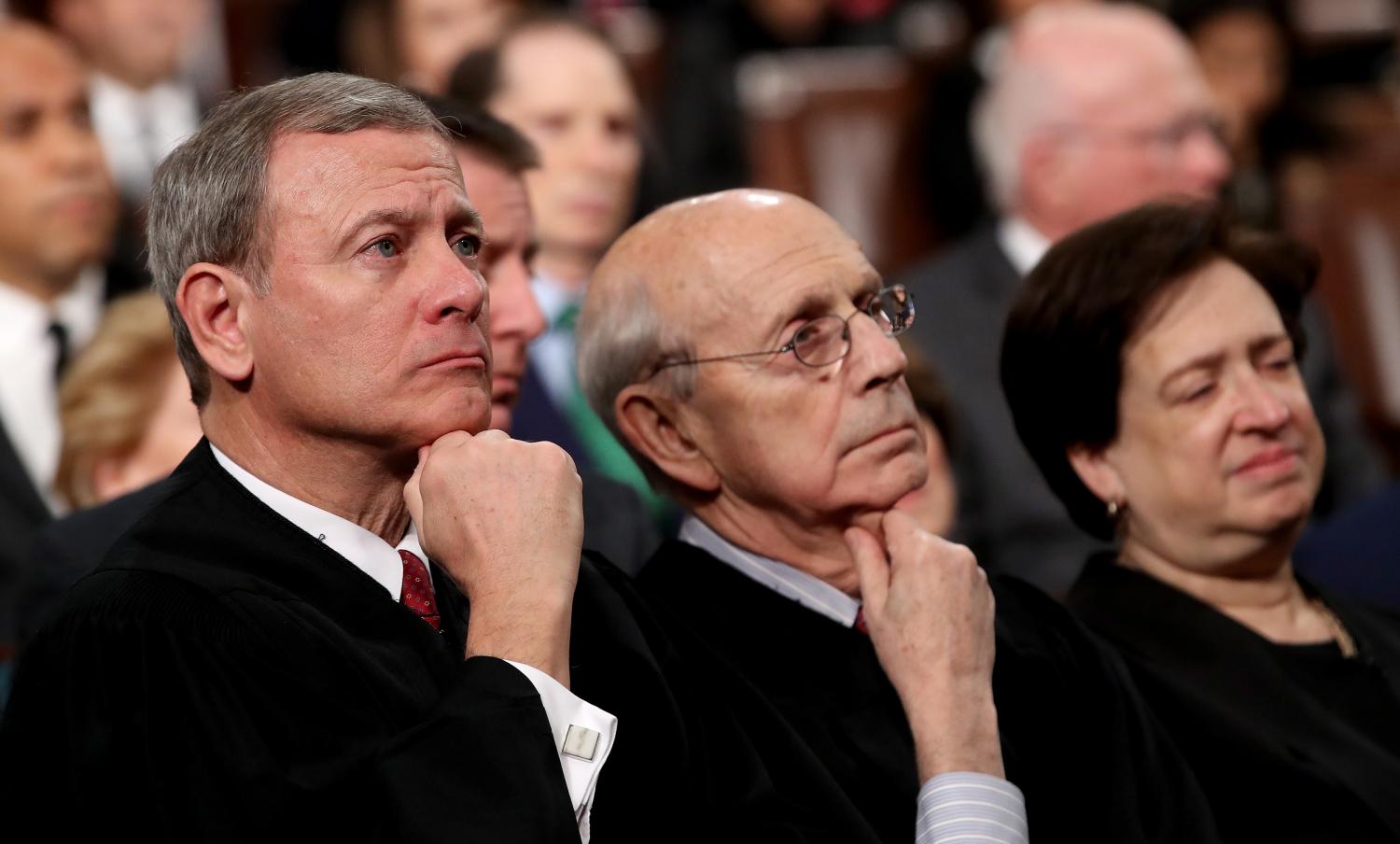 U.S. Supreme Court Chief Justice John G. Roberts  and Associate Justices Stephen Breyer and Elena Kagan listen during U.S. President Donald Trump's first State of the Union address to a joint session of Congress on Capitol Hill in Washington, U.S., January 30, 2018. REUTERS/Win McNamee/Pool - HP1EE1V0CVM4D