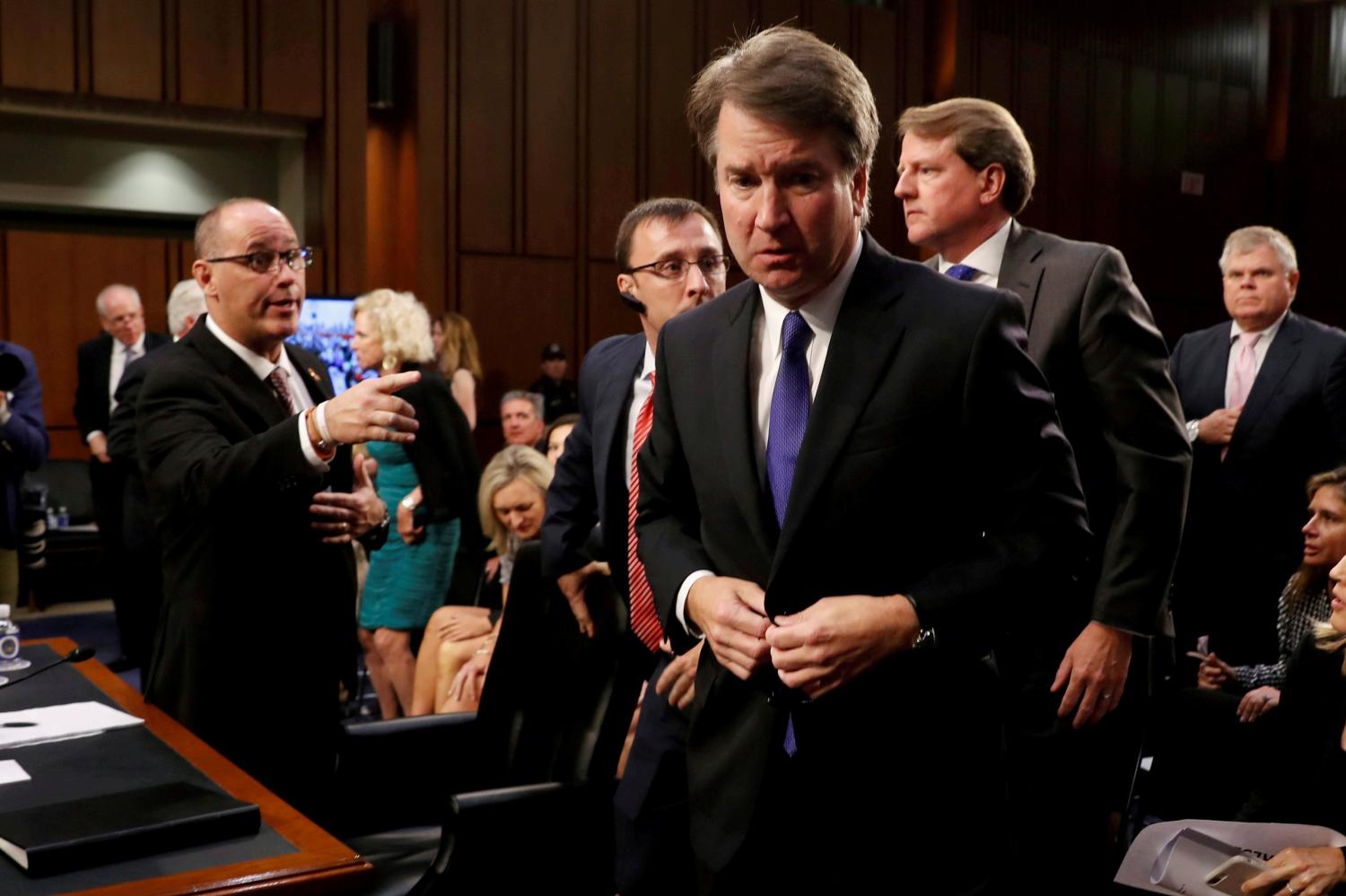 Fred Guttenberg (L), the father of Jaime Guttenberg, a victim of the February 14, 2018 mass shooting in Parkland, Florida, reaches out to try to shake hands with U.S. Supreme Court nominee Judge Brett Kavanaugh during his U.S. Senate Judiciary Committee confirmation hearing on Capitol Hill in Washington, U.S., September 4, 2018. REUTERS/Joshua Roberts      TPX IMAGES OF THE DAY - RC1873BE7E60