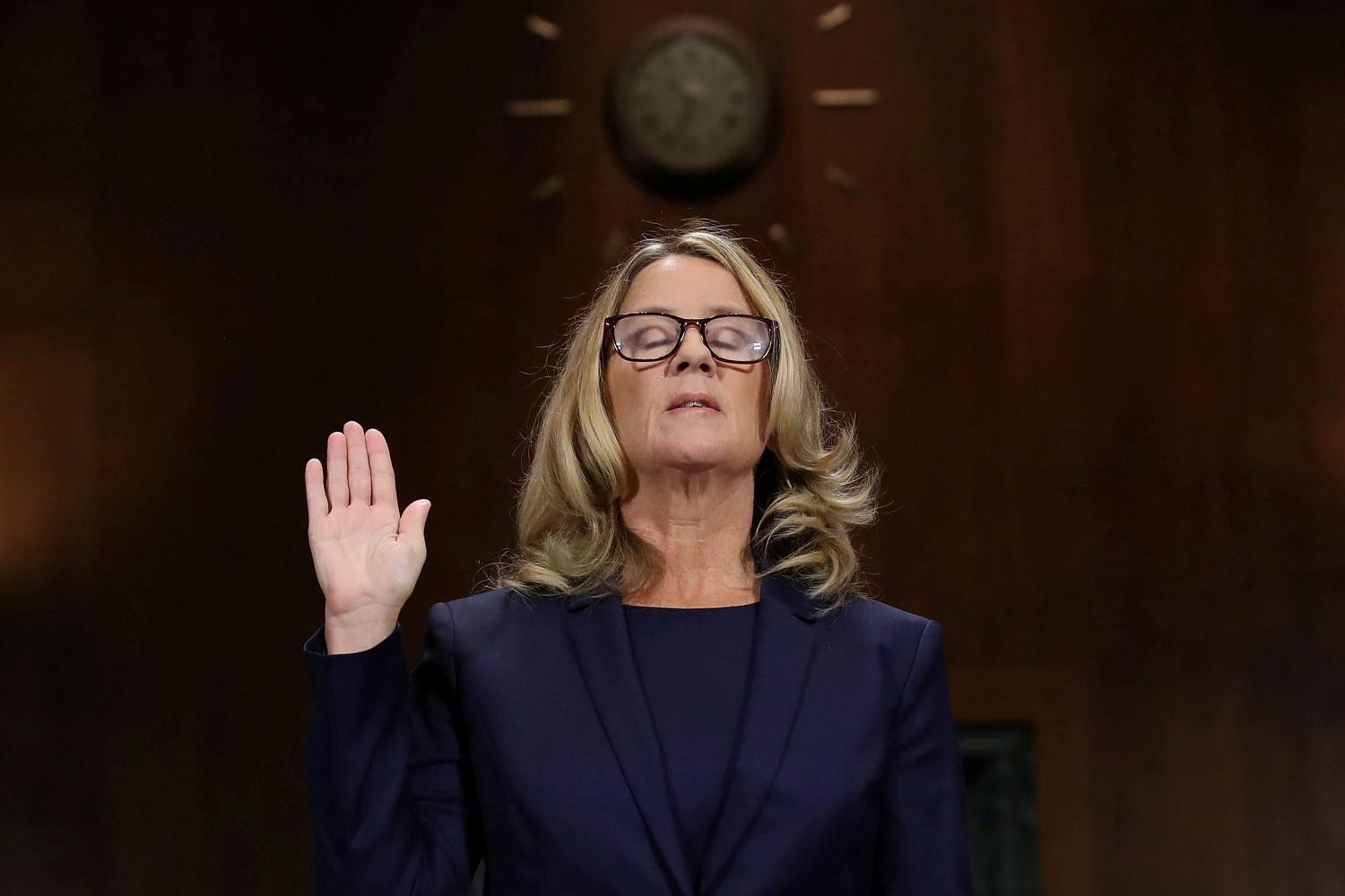 Christine Blasey Ford is sworn in before testifying the Senate Judiciary Committee in the Dirksen Senate Office Building at the Capitol Hill in Washington, DC, U.S., September 27, 2018. Win McNamee/Pool via REUTERS      TPX IMAGES OF THE DAY - RC1F30B69AF0