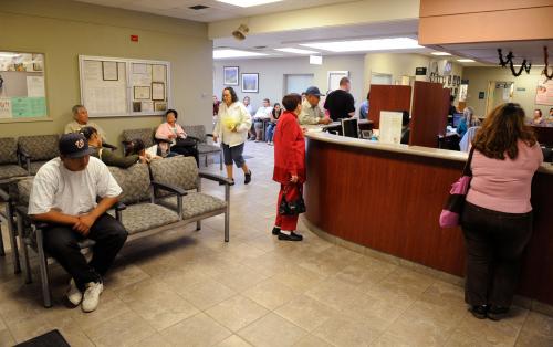 Patients check in at Clinica Sierra Vista's Lamont Community Health Center in Bakersfield, California October 20, 2009. Nowhere in the United States has more doctors at its beck and call than White Plains, one of the wealthiest cities in the nation. Nearly 3,000 miles (4,830 km) away, scaring up a doctor in Bakersfield, situated in California's economically battered Central Valley, is a lot harder. In fact, White Plains has more than twice the number of doctors per capita as Bakersfield, where needy patients until recently had to take a 2-hour bus trip to Fresno to see a diabetes treatment specialist. Picture taken October 20, 2009.  To match Special Report USA-HEALTHCARE/DOCTORS   REUTERS/Phil McCarten (UNITED STATES HEALTH IMAGES OF THE DAY)REUTERS/Phil McCarten (UNITED STATES) - GM1E5B60SNM01