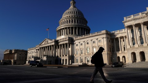 People walk by the U.S. Capitol building in Washington, U.S., February 8, 2018. REUTERS/ Leah Millis - RC13737E70C0