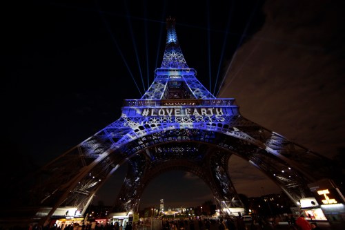 The Eiffel Tower is lit with blue lights as part of the events in the French capital to mark the World Climate Change Conference 2015 (COP21), in Paris, France, December 2, 2015.   REUTERS/Eric Gaillard  - LR2EBC21EP3JD