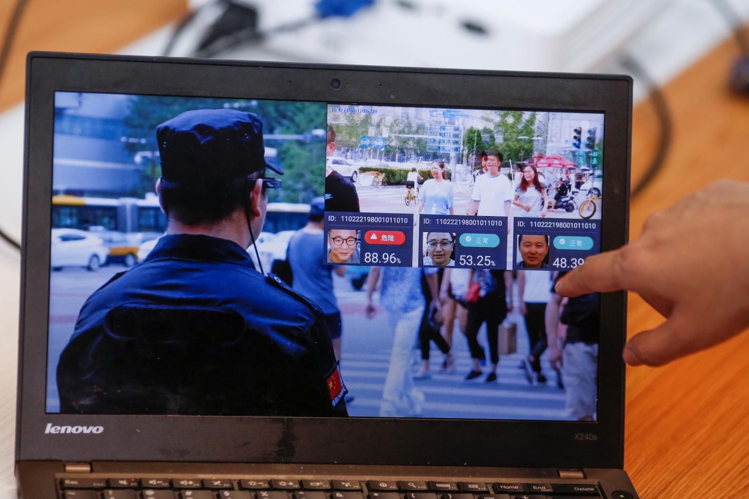 A promotion video shows an actor wearing LLVision facial recognition smart glasses during a demonstration at the company's office in Beijing, China February 28, 2018. Picture taken February 28, 2018. REUTERS/Thomas Peter - RC14E1C100E0