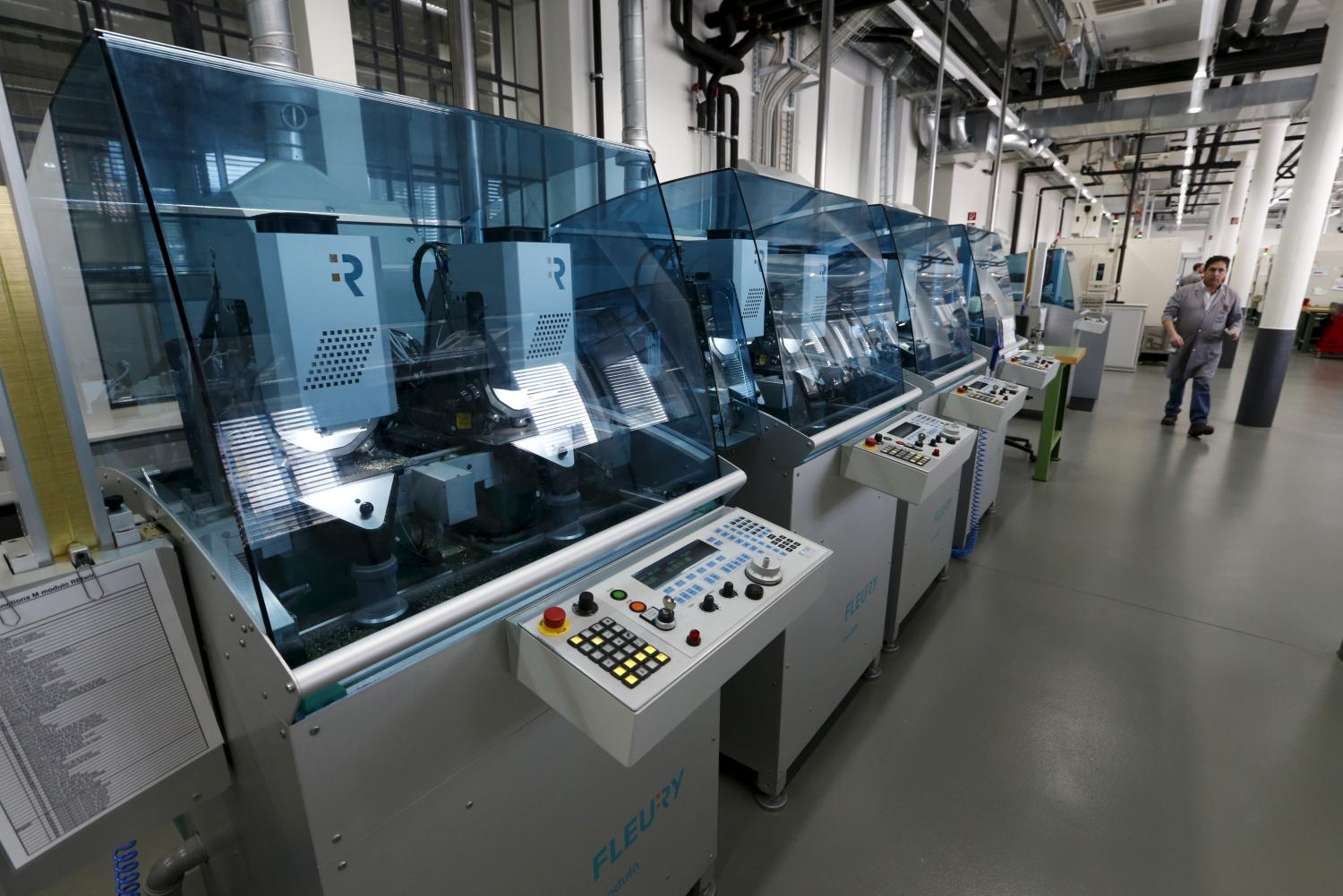 CNC (computer numerical control) machines are pictured in the factory of Swiss watch company Zenith, part of LVMH, in Le Locle, Switzerland, April 6, 2016. The sites of La Chaux-de-Fonds and Le Locle are listed in the UNESCO World Heritage for their watchmaking town-planning.   REUTERS/Denis Balibouse - GF10000378424