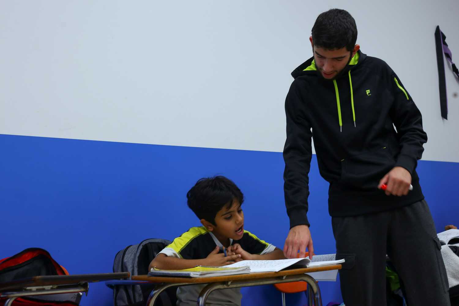 Muslim man teaches student