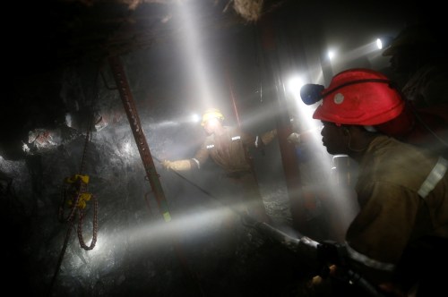 Mine workers employed at Sibanye Gold's Masimthembe shaft operate a drill in Westonaria, South Africa, April 3, 2017. Picture taken April 3, 2017. REUTERS/Mike Hutchings     TPX IMAGES OF THE DAY - RC1ECFE663F0