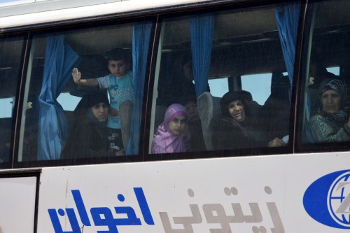 People are seen in the bus released by militants from Idlib, Syria May 1, 2018. SANA/Handout via REUTERS THIS IMAGE HAS BEEN SUPPLIED BY A THIRD PARTY. REUTERS IS UNABLE TO INDEPENDENTLY VERIFY THIS IMAGE AS A SERVICE TO CLIENTS - RC1B3A9E4750