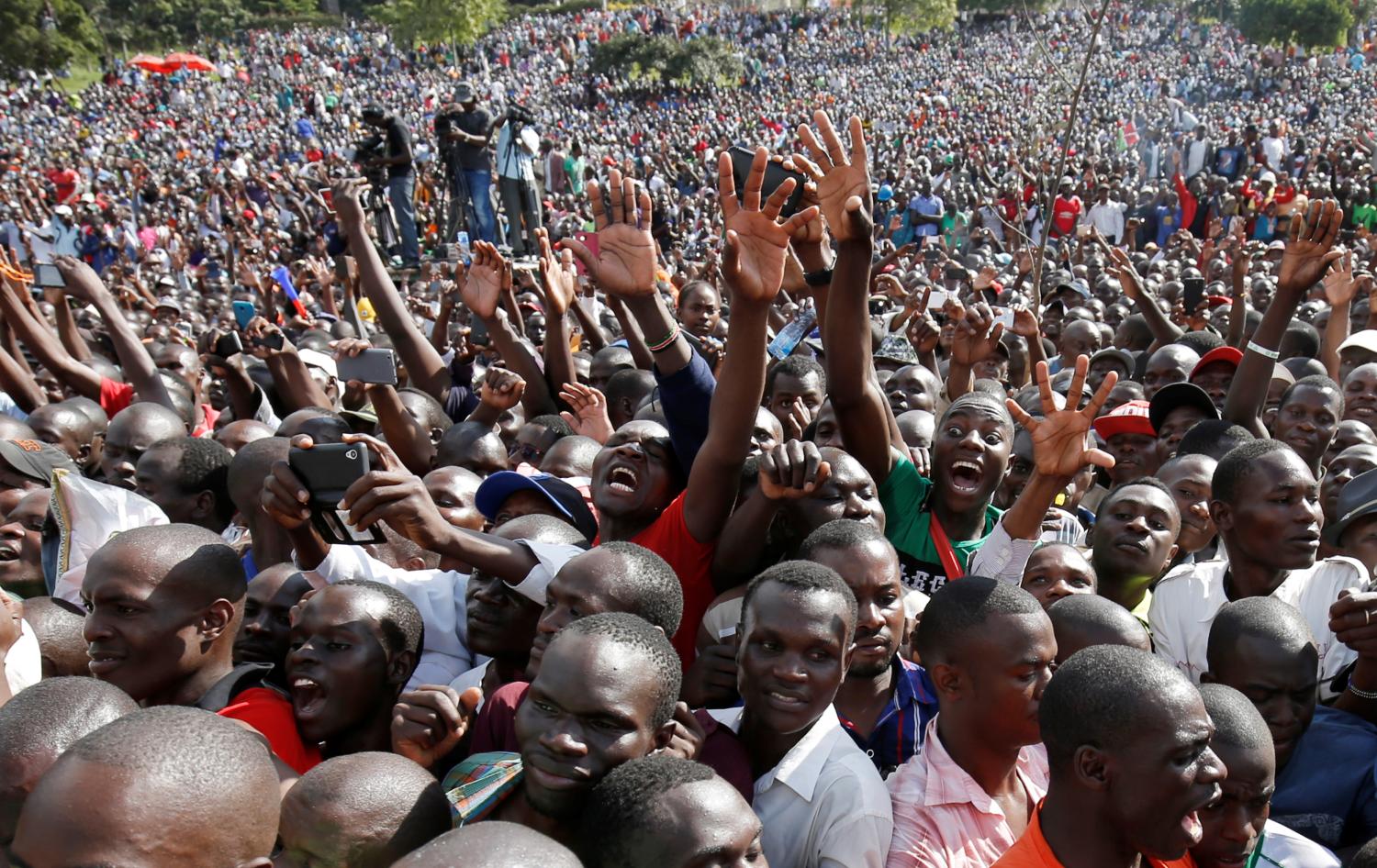 Supporters of Kenya's opposition Coalition for Reforms and Democracy (CORD) cheer during a rally to mark Kenya's Madaraka Day, the 53rd anniversary of the country's self rule, at Uhuru Park grounds in Nairobi, Kenya, June 1, 2016. REUTERS/Goran Tomasevic     TPX IMAGES OF THE DAY      - S1BETHKLCSAA