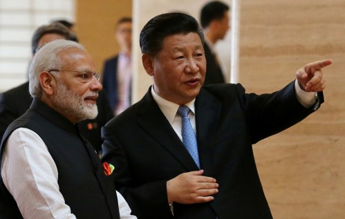 Chinese President Xi Jinping and Indian Prime Minister Narendra Modi talk as they visit the Hubei Provincial Museum in Wuhan, Hubei province, China April 27, 2018. China Daily via REUTERS  ATTENTION EDITORS - THIS IMAGE WAS PROVIDED BY A THIRD PARTY. CHINA OUT. - RC181C1E18F0