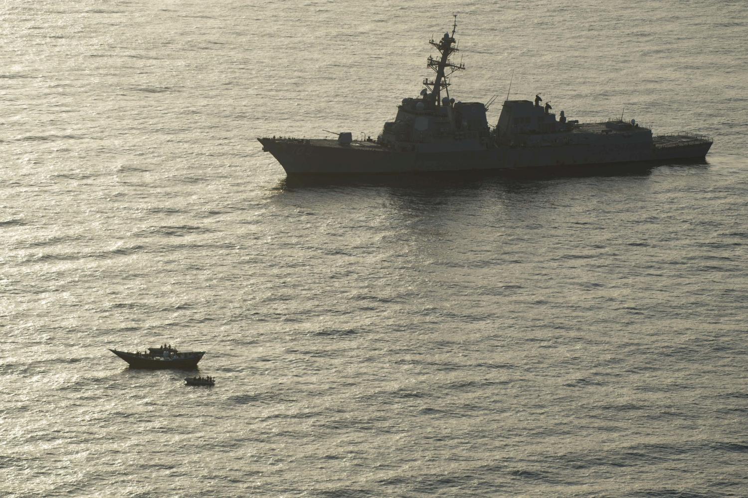 A search and seizure team from the guided-missile destroyer USS Jason Dunham inspect a traditional dhow, or sailing vessel, carrying a shipment of over 1,000 illicit weapons in the Gulf of Aden, August 28, 2018. Picture taken August 28, 2018. Naval Aircrewman 3rd Class Cole Cruikshank/U.S. Navy/Handout via REUTERS   ATTENTION EDITORS - THIS IMAGE WAS PROVIDED BY A THIRD PARTY - RC12C0CFE740