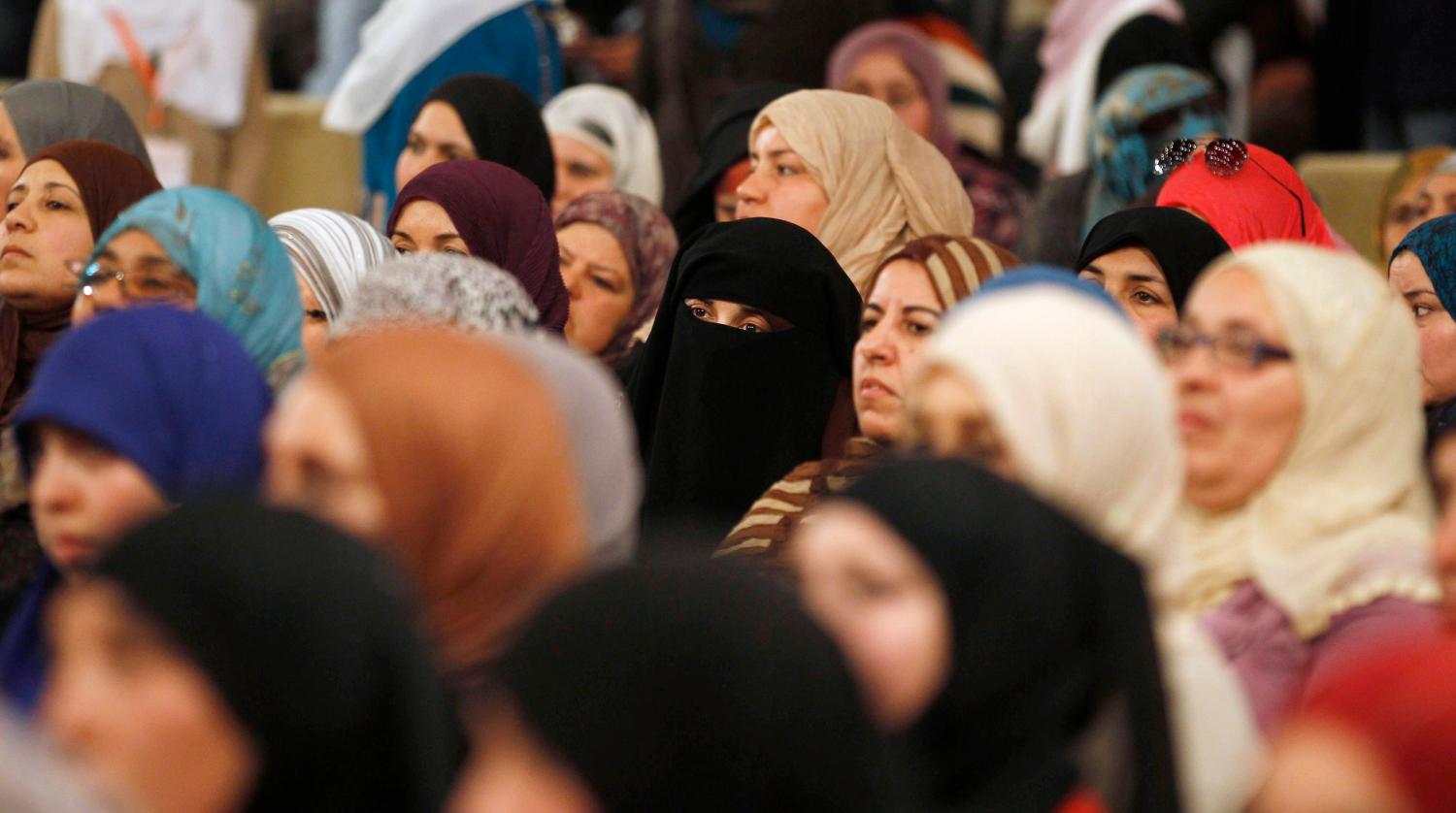 Supporters of the Islamist Ennahda movement, Tunisia's main Islamist political party,attend a meeting regarding International Women's Day in Tunis March 10, 2013.  International Women's Day fell on March 8. REUTERS/Zoubeir Souissi (TUNISIA - Tags: POLITICS SOCIETY) - GM1E93B08HP01