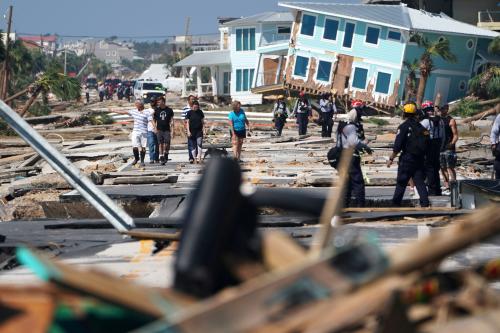 First responders and residents walk along a main street following Hurricane Michael in Mexico Beach, Florida, U.S., October 11, 2018. REUTERS/Carlo Allegri     TPX IMAGES OF THE DAY          TPX IMAGES OF THE DAY - RC18397C0100