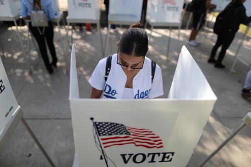 Cynthia Lazo, 25, votes in the U.S. congressional and gubernatorial midterm elections in Norwalk