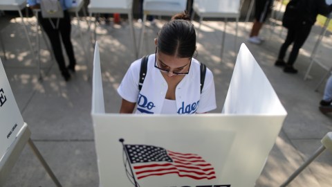 Cynthia Lazo, 25, votes in the U.S. congressional and gubernatorial midterm elections in Norwalk, California, United States, October 24, 2018. REUTERS/Lucy Nicholson - RC1EEBF1A1D0