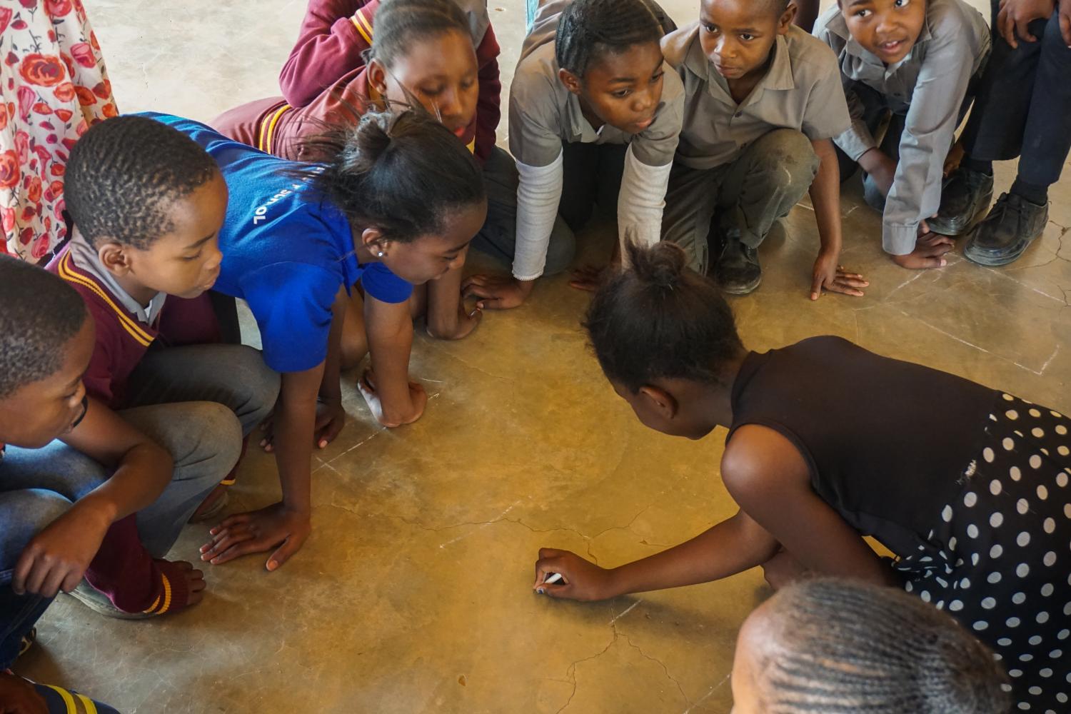 Kids sitting on the floor