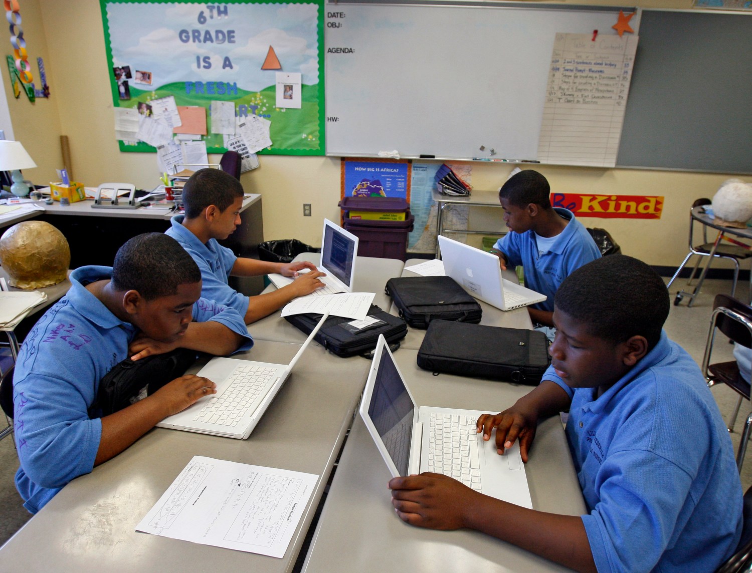 Students at the Lilla G. Frederick Pilot Middle School use their laptops during a class in Dorchester, Massachusetts June 20, 2008. From online courses to kid-friendly laptops and virtual teachers, technology is spreading in America's classrooms, reducing the need for textbooks, notepads, paper and in some cases even the schools themselves.  To match feature USA-EDUCATION/TECHNOLOGY  REUTERS/Adam Hunger  (UNITED STATES) - GM1E4770O4801