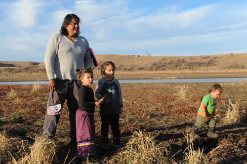 A family from the Cheyenne River tribe plays together near Turtle Island during a protest against plans to pass the Dakota Access pipeline near the Standing Rock Indian Reservation, near Cannon Ball, North Dakota, U.S. November 26, 2016. REUTERS/Stephanie Keith - RC11F6A7B3D0