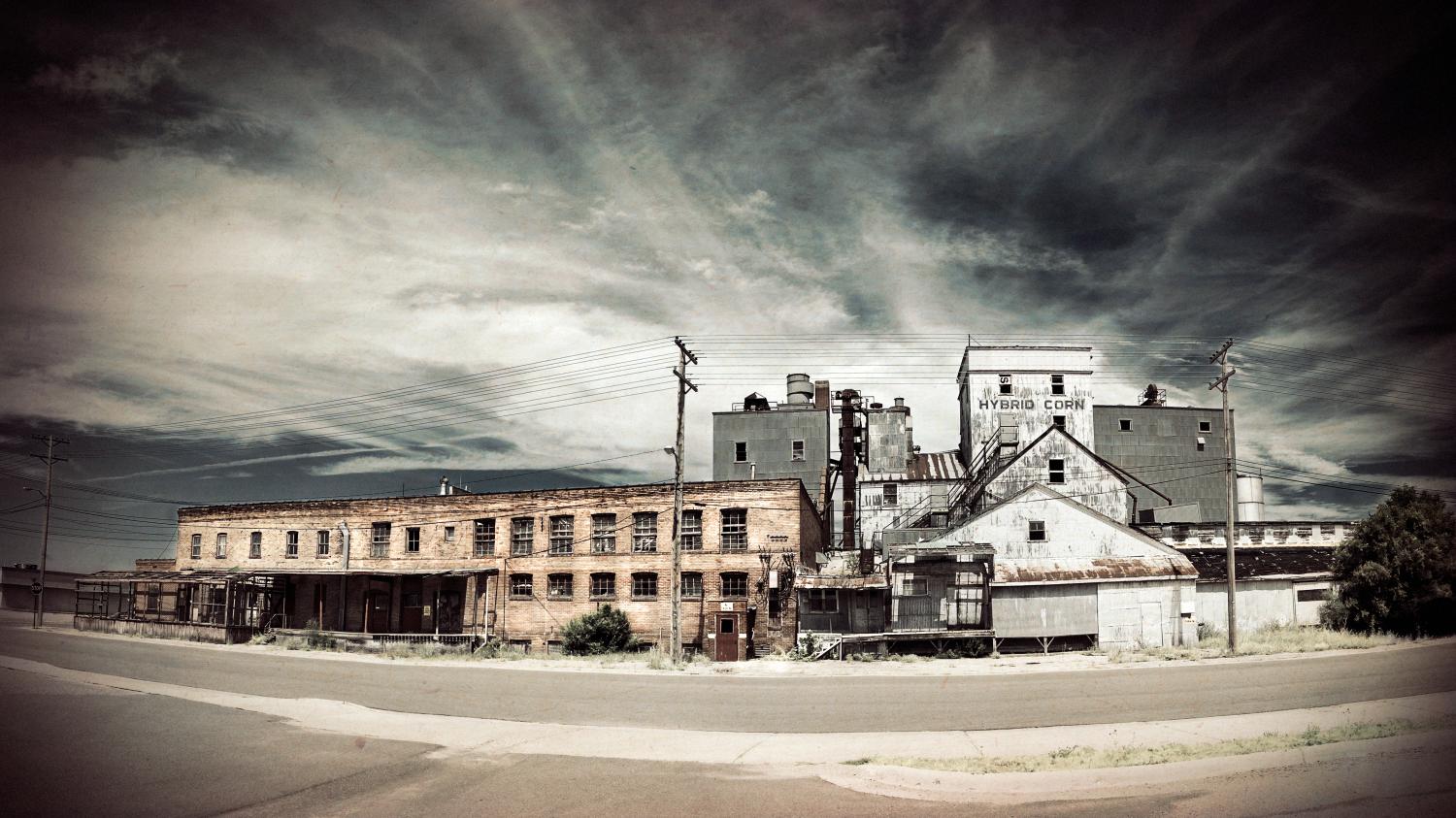 An old an abandoned corn processing factory and farm supply store in a small town in Minnesota.