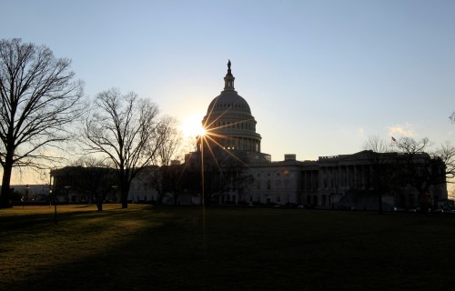 The sun sets behind the U.S. Capitol building hours before U.S. President Barack Obama is set to deliver his his State of the Union address to a joint session of Congress on Capitol Hill in Washington, January 24, 2012.  REUTERS/Jim Bourg   (UNITED STATES - Tags: POLITICS) - GM1E81P0HN101
